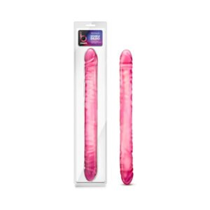 Hot pink double-ended PVC toy with realistic texture, shown in and out of clear packaging